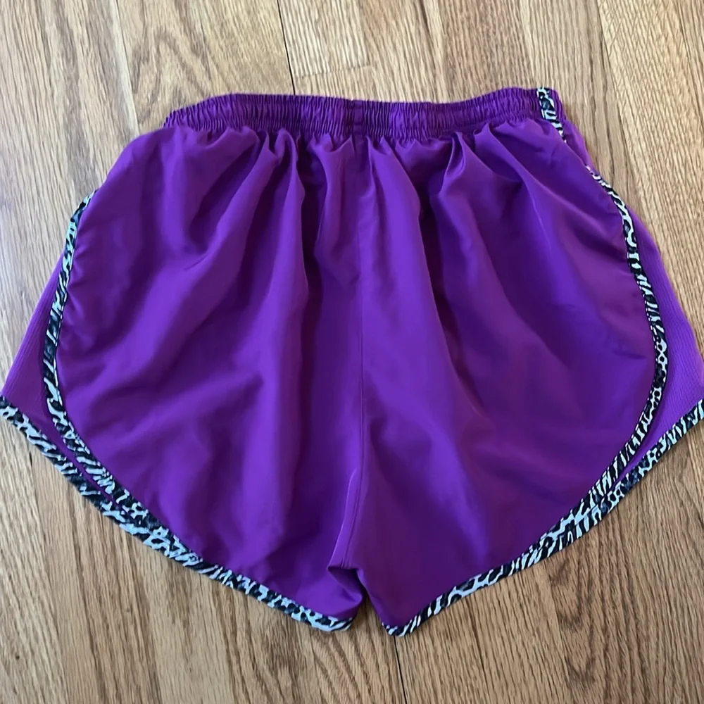 Women’s purple Dri-Fit Nike running shorts with animal print